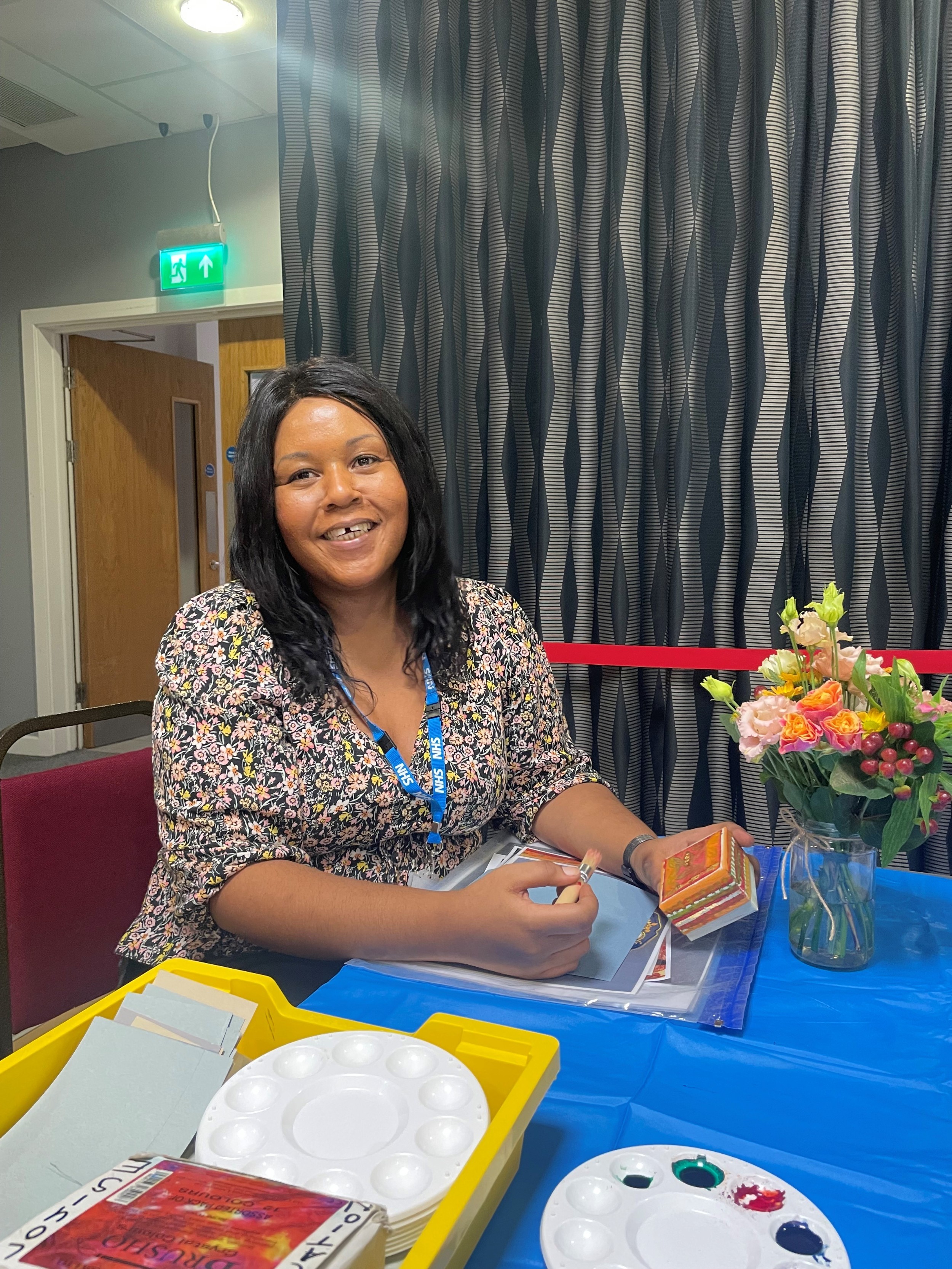 Image displays woman carer participating in craft workshop 