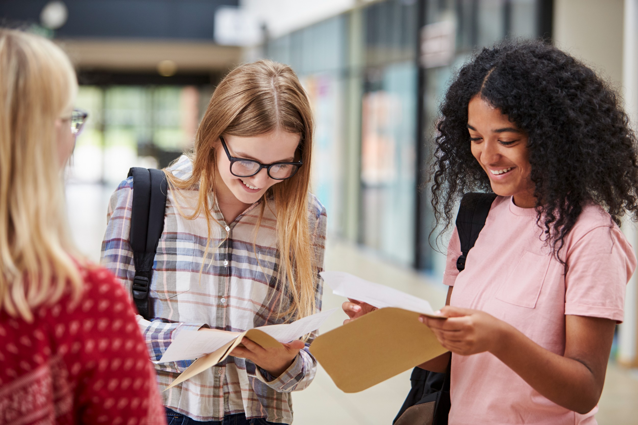 female-college-students-opening-exam-results-2021-08-26-16-13-48-utc.jpg